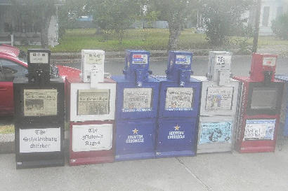 Texas - Newspaper racks on a rainy day