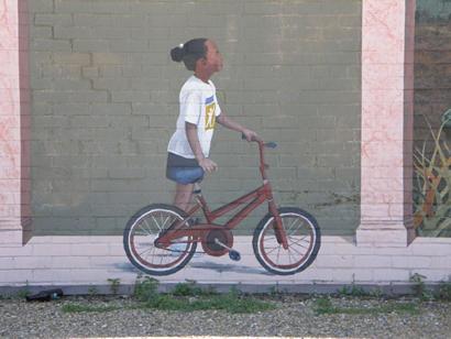 Ville Platte, Louisiana Painted Wall Mural detail Little Girl with bike by Waven Boone.
