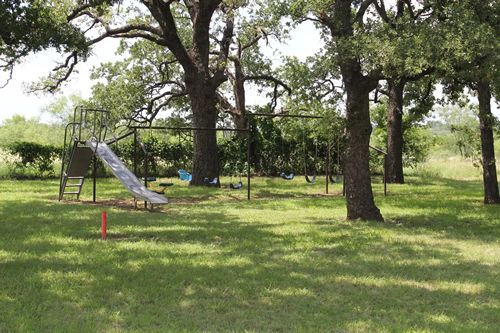 Beattie TX - Church playground with slide and swings