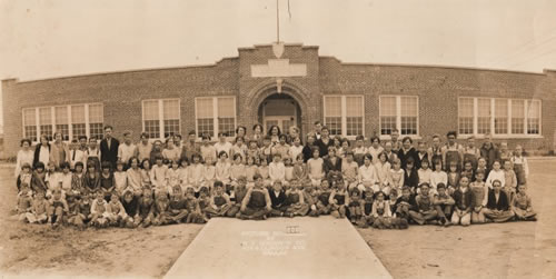 Coppell, TX - Students and teachers outside Coppell School, c. 1928.