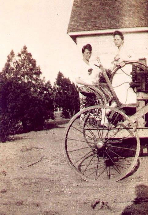 Coppell, TX - Jewel "Jack" Kirkland (L) and sibling on a tractor, c. 1920. 