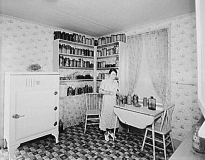 Woman canning in kitchen, DalworthingtonGardensTexas/Dalworthington Gardens Texas 1930s photo