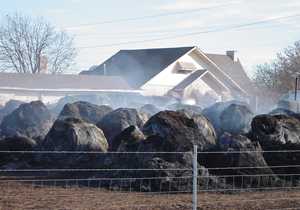 Hay bales smoldering after January 2006 fire in Ringgold, Texas