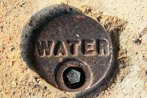 "water" on sidewalk, Calvert Texas