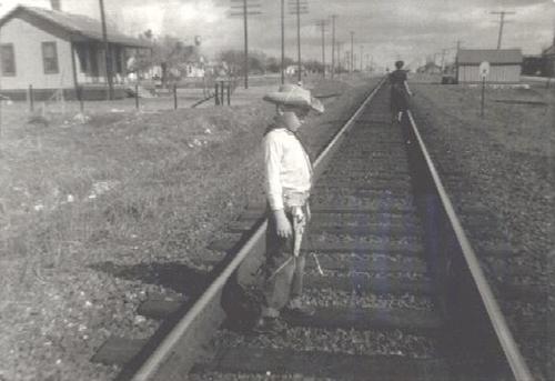 Marion Texas Boy in cowboy suit railroad tracks