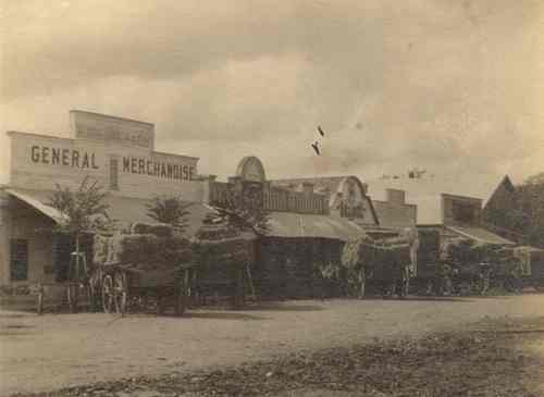 General Merchandise and Wagons in downtown Marion Texas  old photo