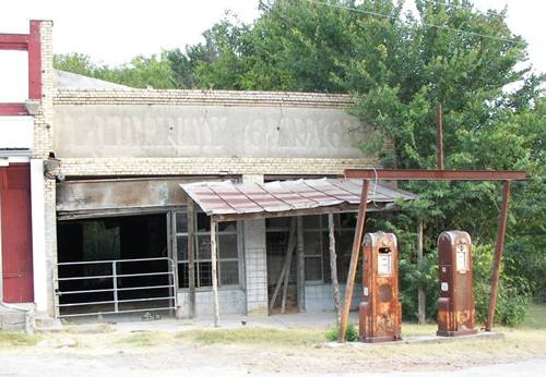Old gas pump and old gas station, Red Rock, Texas