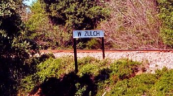 TX - West Zulch sign by railroad track