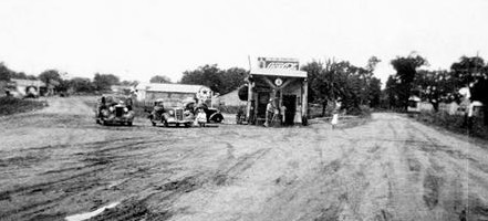 Vintage photo of gas station and cross road in Montgomery, Texas