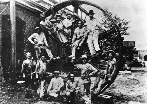 Men on Wheel, Rusk, Texas vintage photo