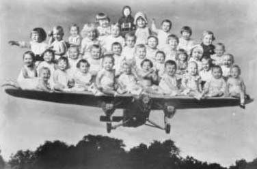 babies on airplane - Schulenburg TX old photograph