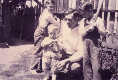 Zola showing baseball to his sons