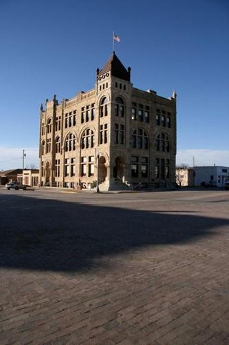 1890 Ness County Bank building on brick street, Ness City, Kansas 
