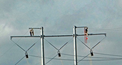 Linemen working on wires high up, Tivoli TX 