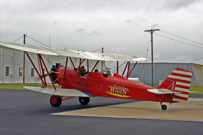 A bi wing open cockpit plane at Aransas County Airport