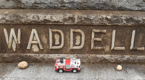 Toy firetruck on Rube Waddell tombstone, San Antonio, TX