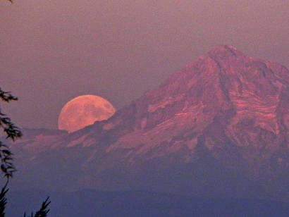 Blue moon rising behind Mt Hood