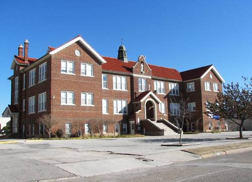 Muenster Texas - Sacred Heart School statue and weathervane