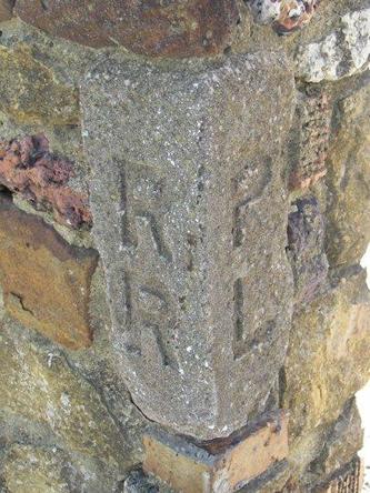 Old, stone railroad marker, Elmendorf Texas  