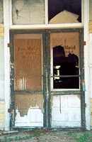 Door of old grocery store in Weesatche  Texas