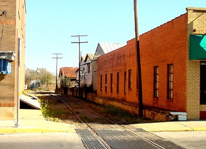 Brenham, Texas - Alley with railroad tracks 
