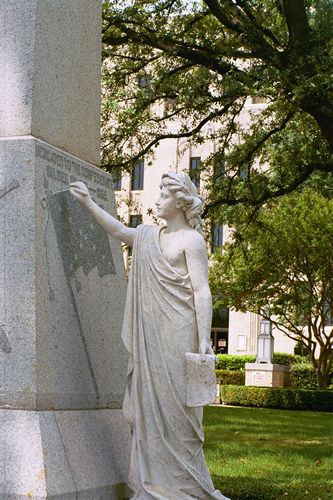 Goddess and the Confederate marker on the Gregg County courthouse lawn