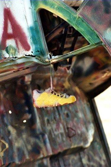 Shoe hanging on Cadillac, Cadillac Ranch Amarillo Texas