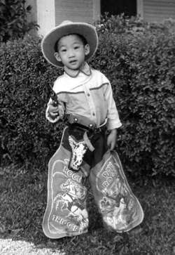 Chinese kid in cowboy outfit
