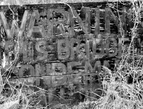 Woodson Texas suspension bridge  condemned sign