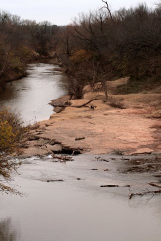 Looking over the Brazos River from Woodson Texas suspension bridge  