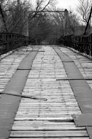 Walking over Woodson Texas suspension bridge 