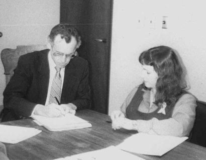 JoNell Haas signing paper to title of Blano Courthouse land