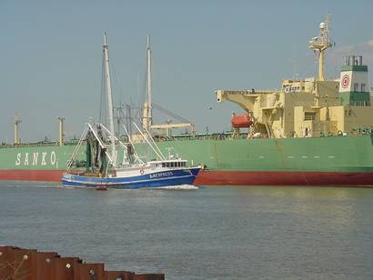 Sabine Pass Texas shrimpboat and tanker on ship channel