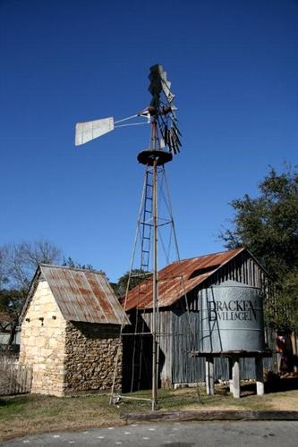 Bracken Texas windmill, rock building and water tank