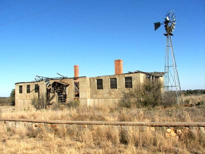 Camp San Saba Texas - abandoned house with windmill