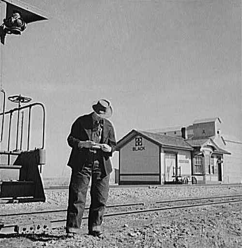 Black, Texas depot and conductor, old photo