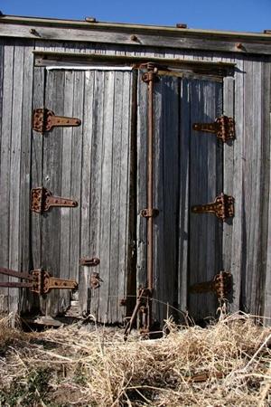 Claude Texas old wood door  with  old rusted hinges