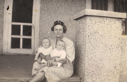 Alice Akers and grandkids on porch of 1927 home in Higgins Texas