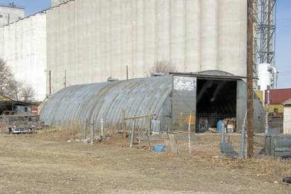 Quonset hut and grain elevators, Lariat Texas 