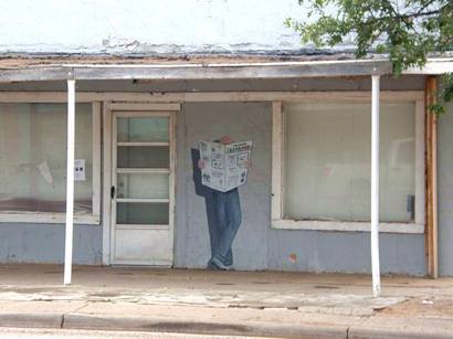 Lorenzo Tx Street Painted Wall Mural of Man Reading Newspaper