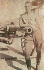 Sergeant polishing artillery