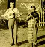 Two boys playing instrument