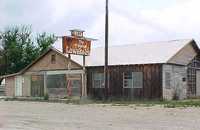 Here's the old Lowake Inn, in Lowake, Texas, looking abandoned--the airfield was in back of this building. <img alt=