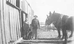 Panhandle family with barn and mules