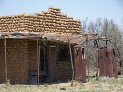 Medicine Mound Texas - W.W. Cole.Building and Old  gas pumps 