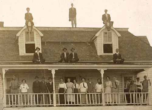People standing on rooftop and balcony, Scranton Academy, Scranton Texas old photo