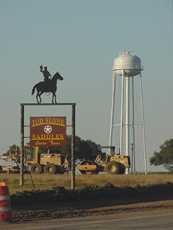 Cowboy silhouette and Water tower at Cuero, Texas