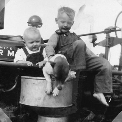 Rosebud TX - Robert and Henry Skupin On Tractor with dog Max