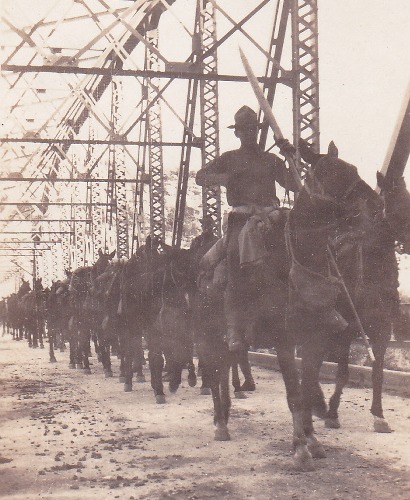 Corporal on horse crossing Pecos River Bridge, old photo