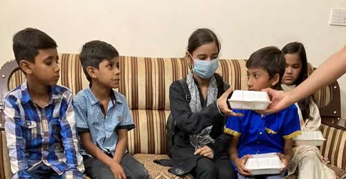 Little Linguists of Lahore given rice for lunch